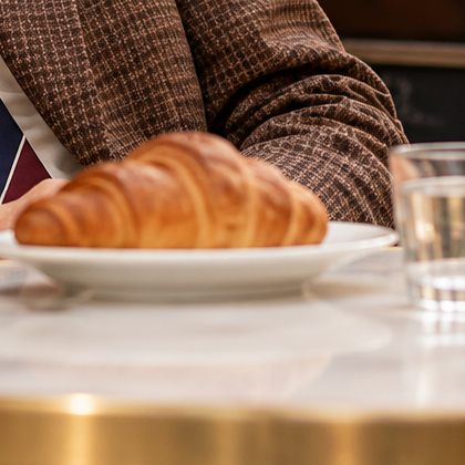A croissant on a café table